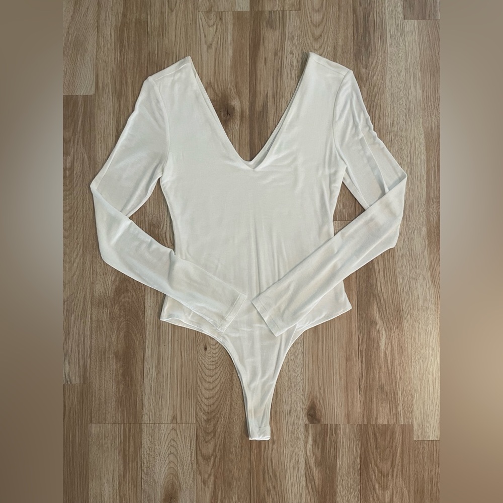 White long sleeved bodysuit